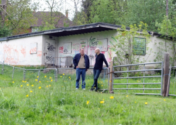 Two Men at the Field Gate