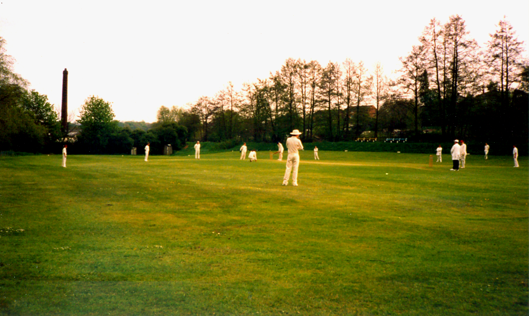 A match in progress at Highbury, with the old mill chimney in the background